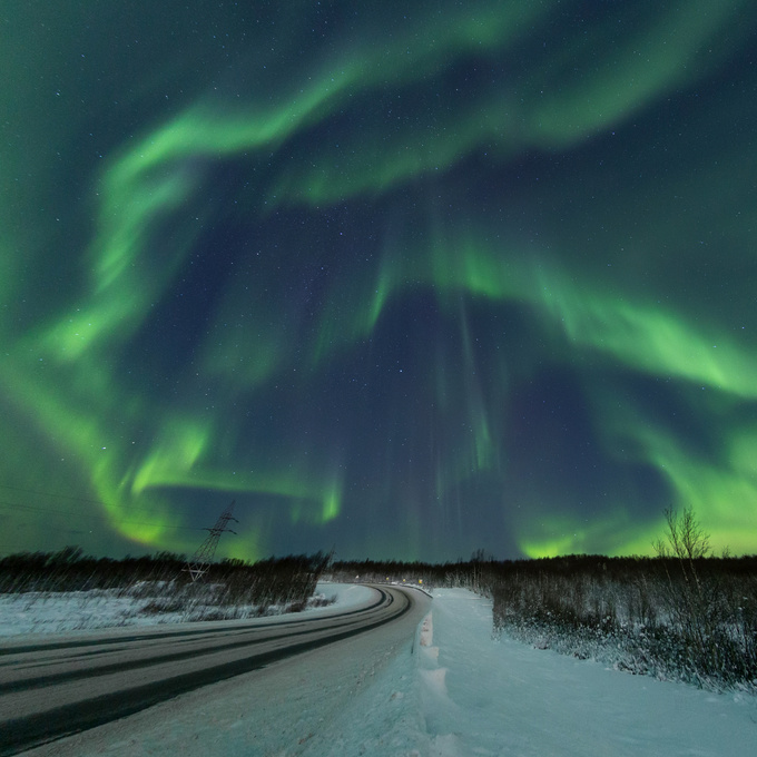 Northern lights over the road